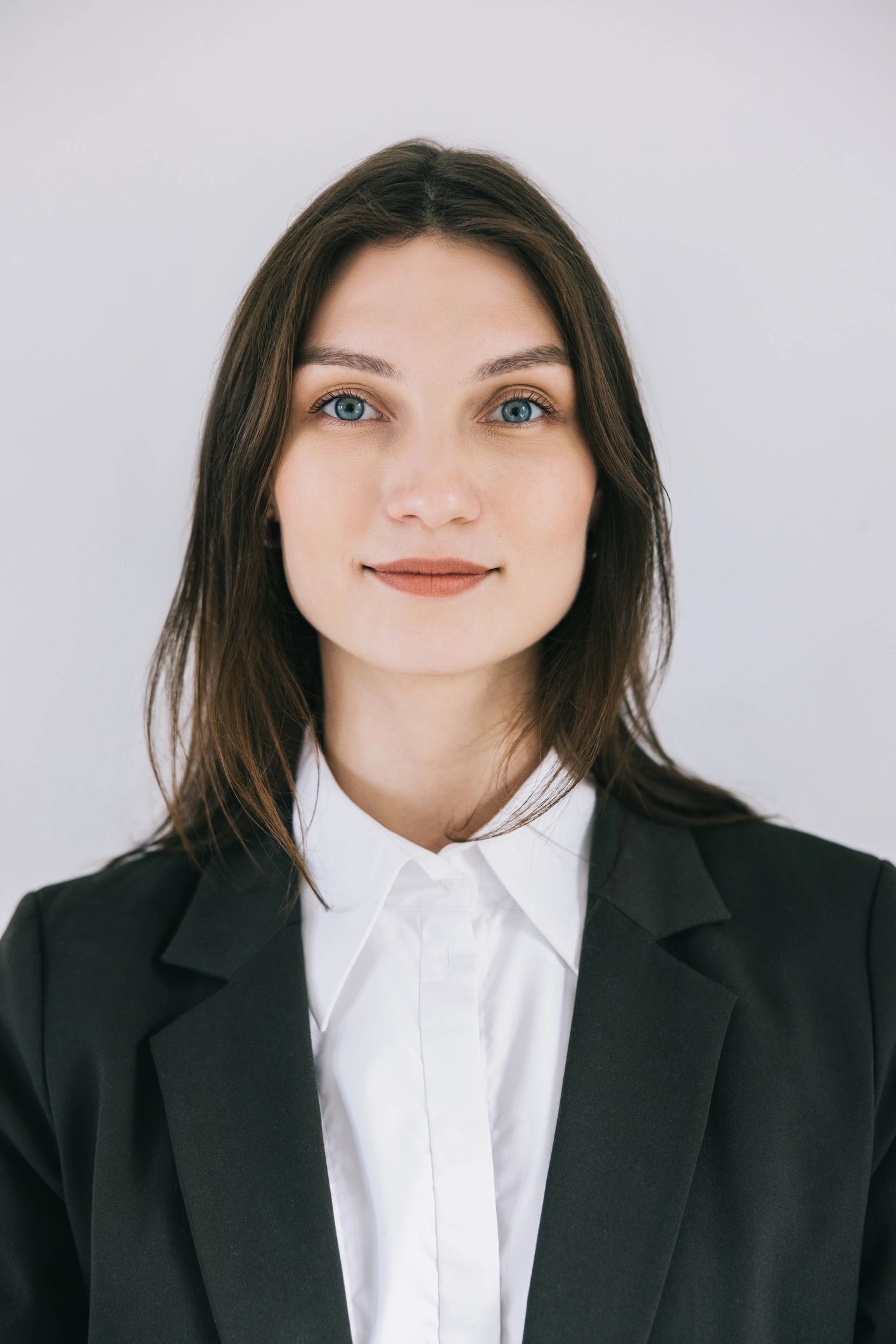 Professional headshot representing performance coaching